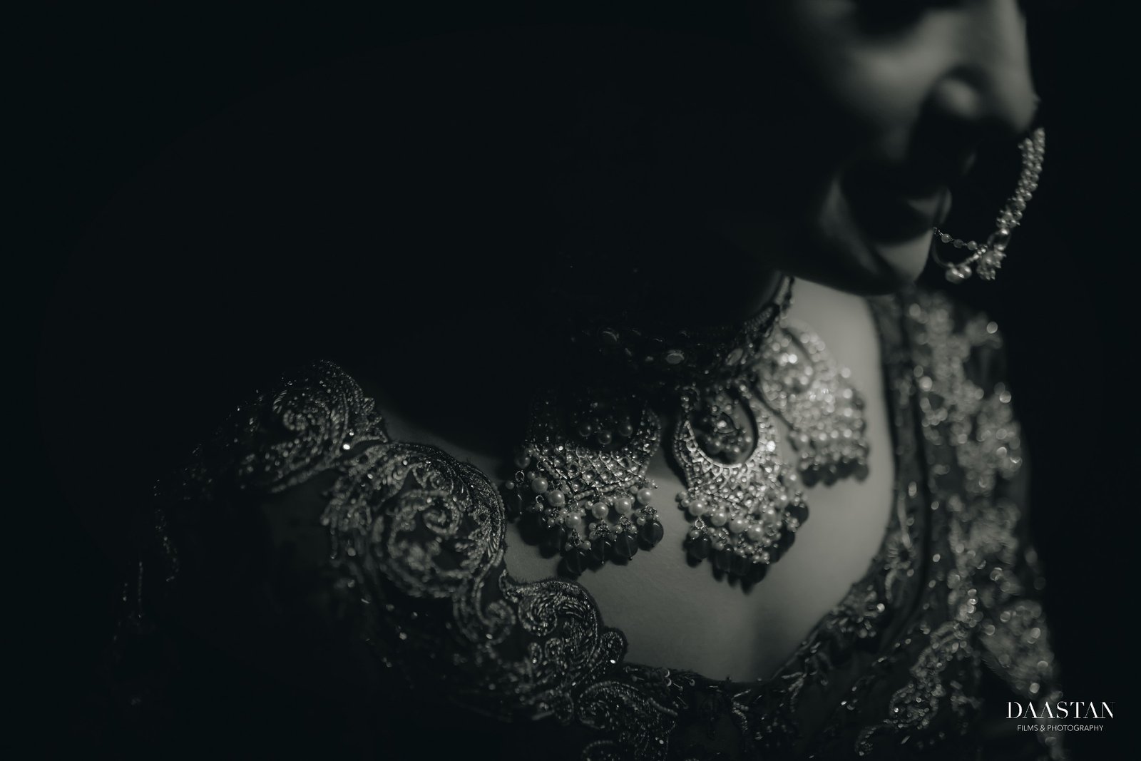 Black and white close-up of bridal jewellery necklace, artistic wedding photography by Indian production house