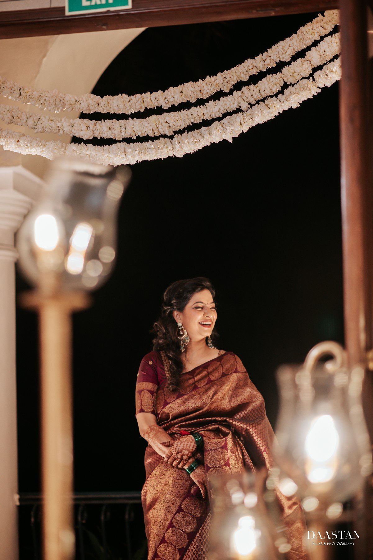 Bride photographed in hotel corridor with natural side light, cinematic wedding portrait India