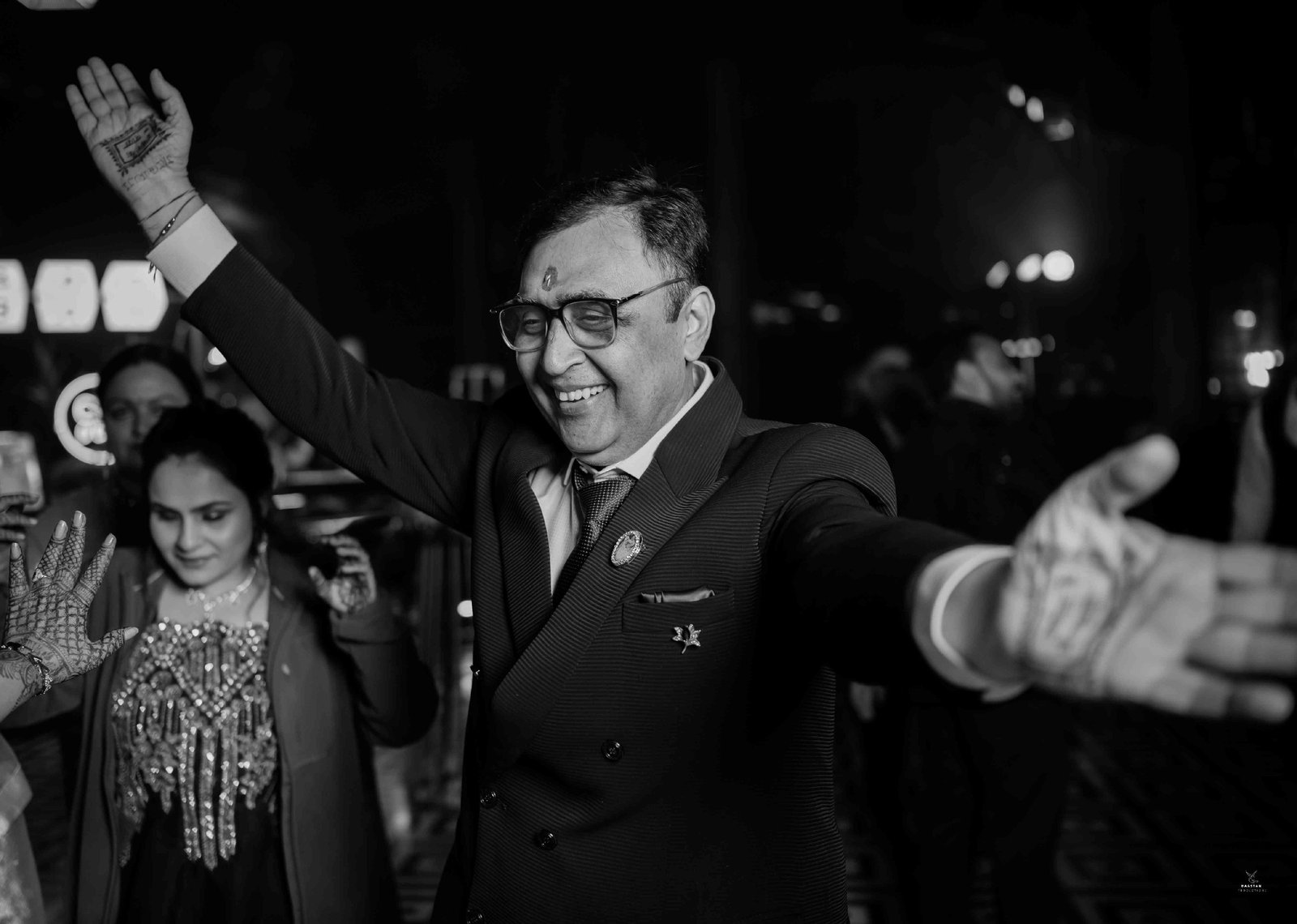 Bride dancing at sangeet night celebration, joyful candid wedding photography India