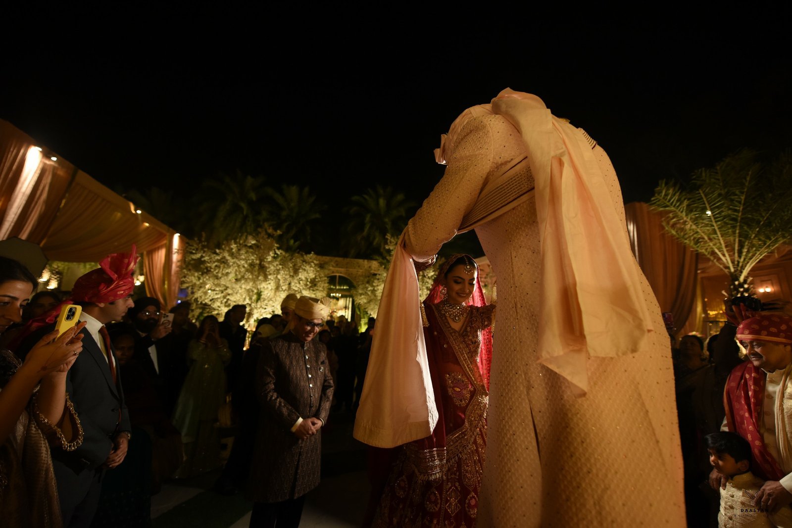 Bride's grand entry at wedding reception captured candidly, cinematic Indian wedding production
