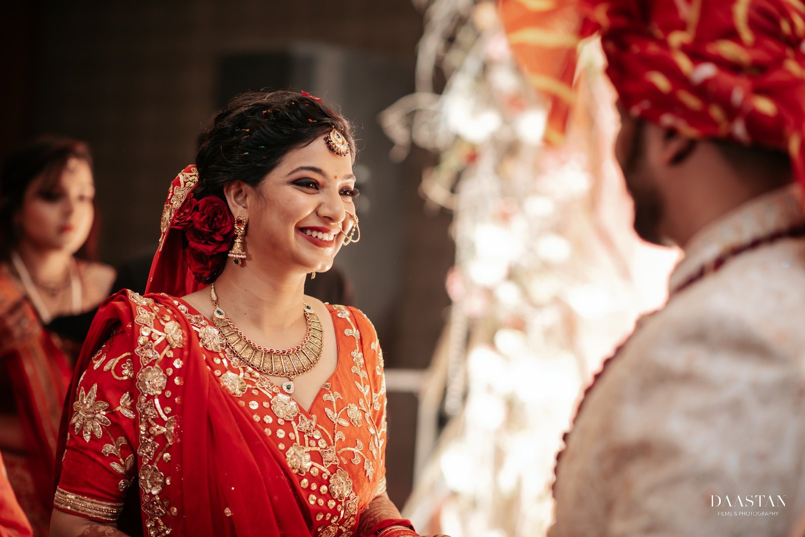 Bride with family during candid wedding ceremony moment, Indian wedding production house