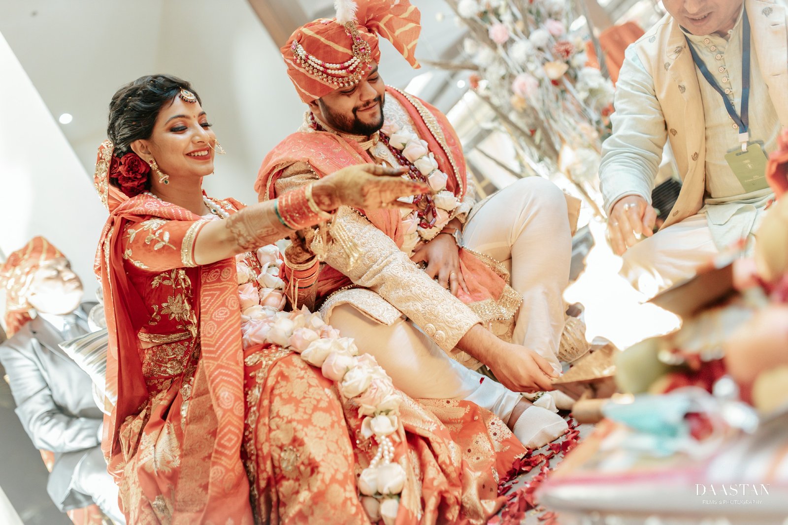 Bride during traditional ritual with family at Indian wedding ceremony, candid photography
