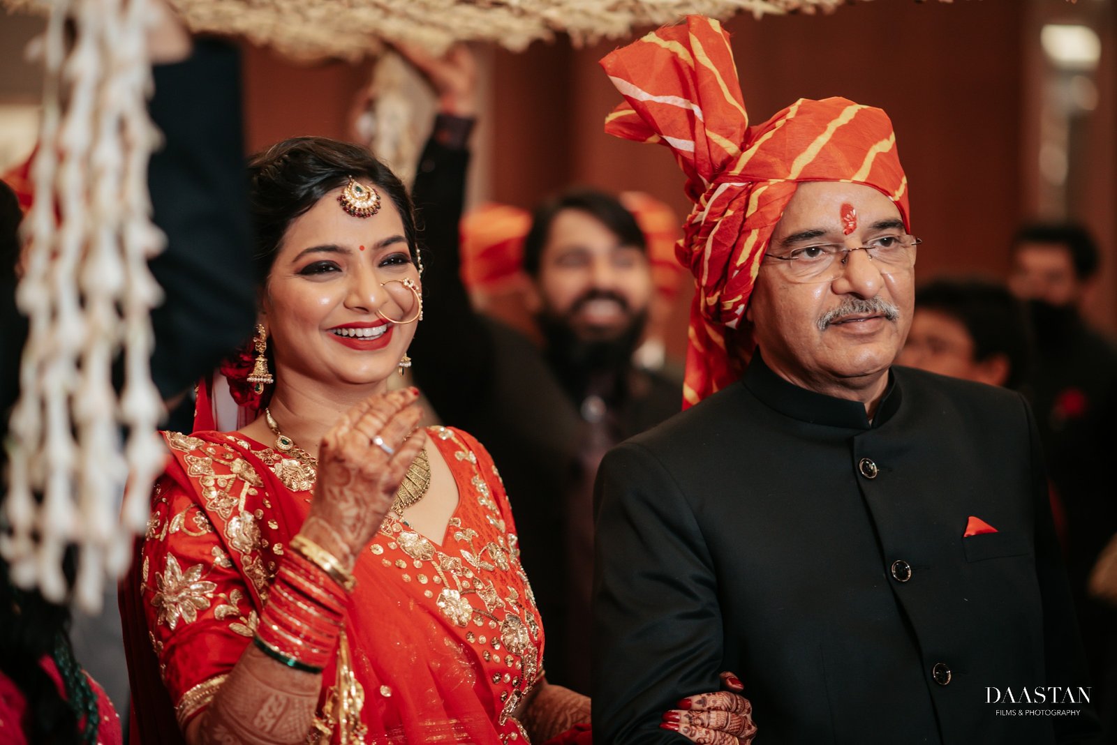 Emotional candid moment between bride and father at Indian wedding, touching photography