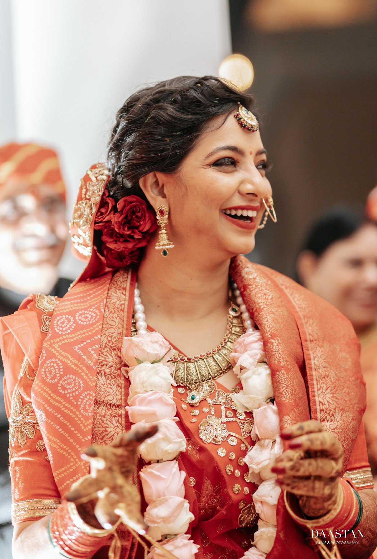 Bride getting ready with jewellery at Indian wedding, behind-the-scenes wedding photography