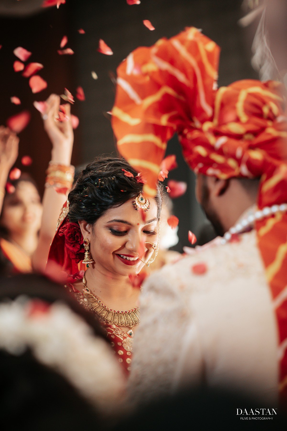 Petal shower during bride and groom pheras at Indian wedding, cinematic wedding photography
