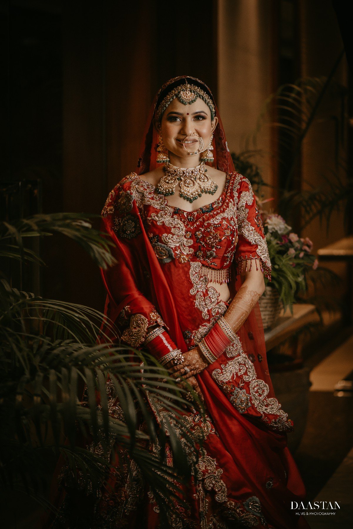 Beautiful Indian bride in bridal lehenga photographed during wedding by professional production house