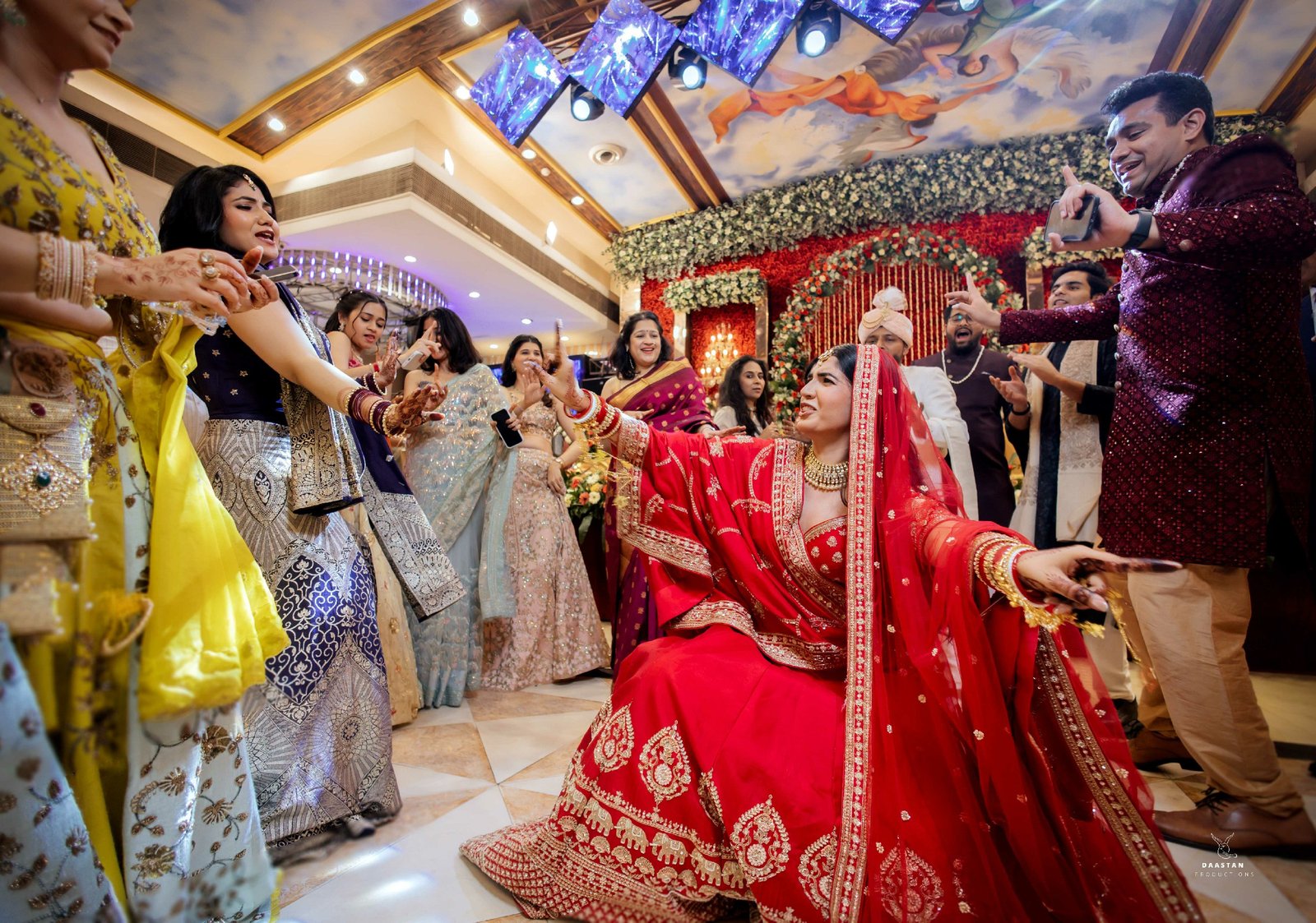 Bride during wedding procession at beautifully decorated Indian wedding venue, professional photography