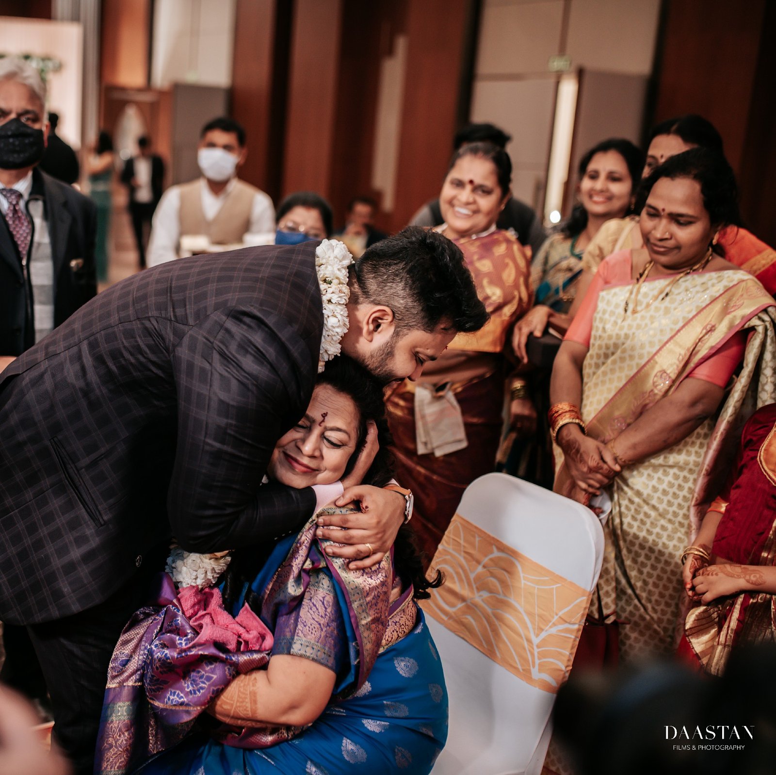 Candid moment of family blessing during Indian wedding ceremony captured by professional wedding production house
