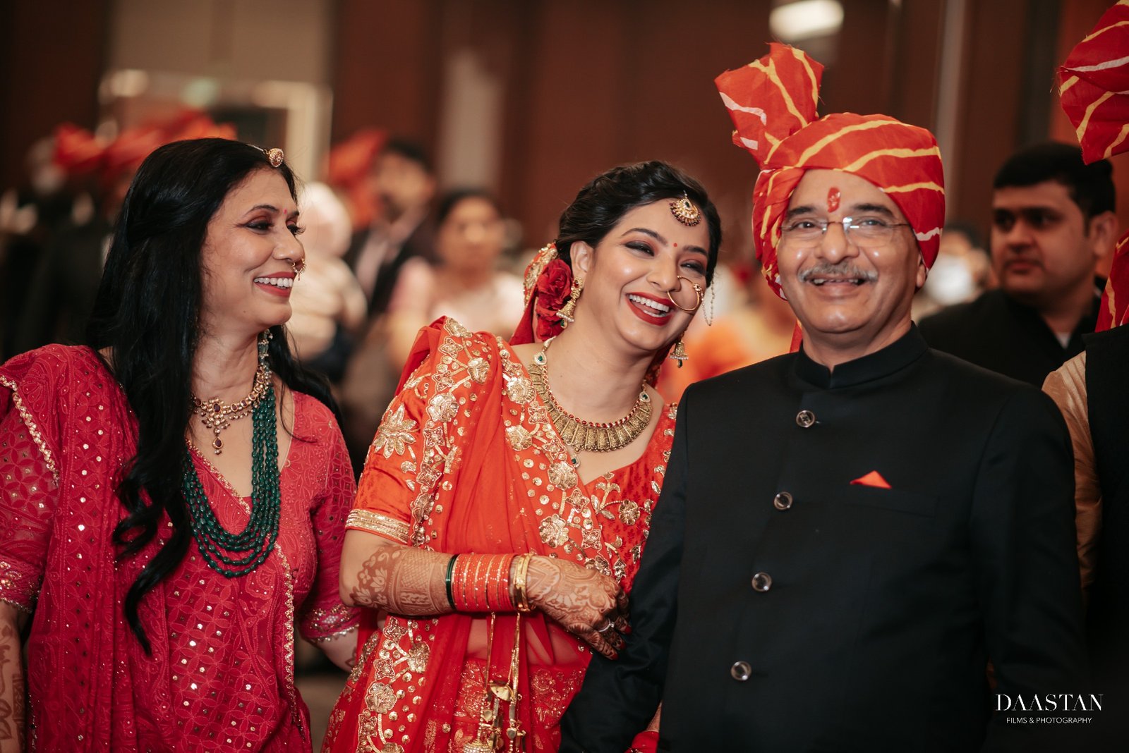 Couple with guests during wedding reception celebration, professional Indian wedding event photography