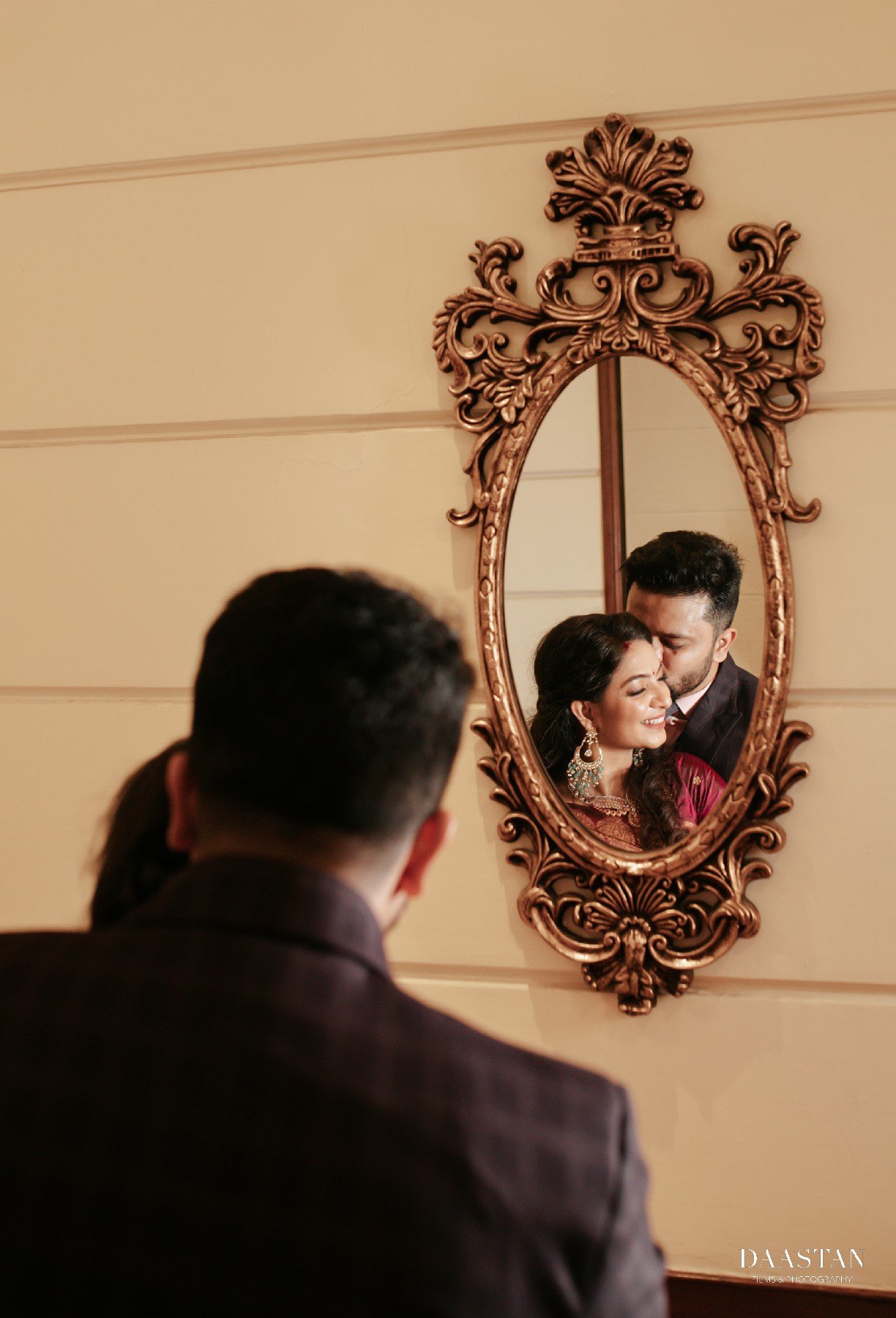 Artistic mirror reflection portrait of bride and groom, creative wedding photography by Indian production house