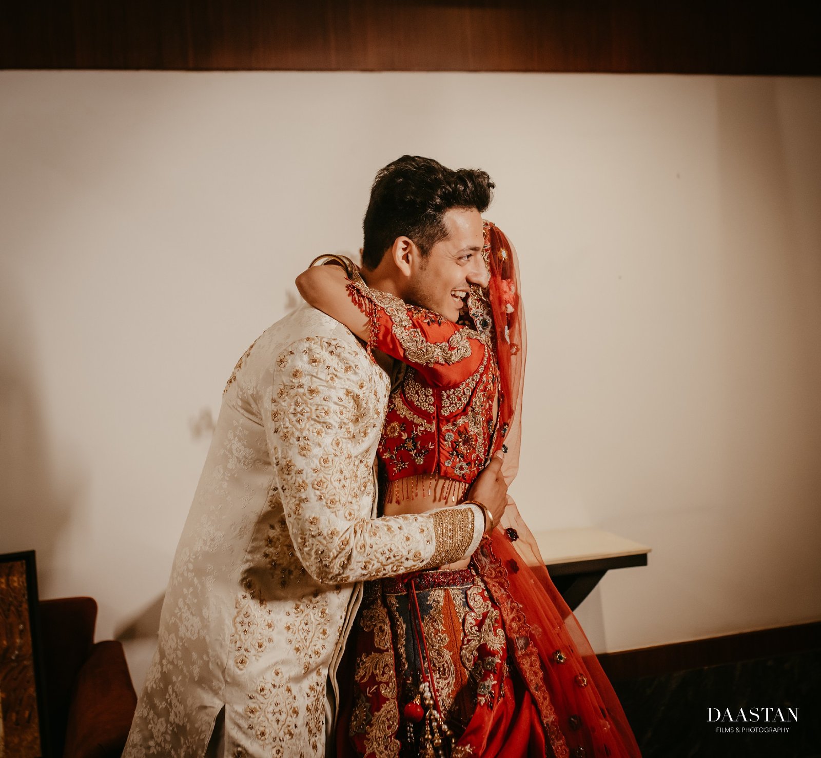 Romantic close embrace portrait of bride and groom, cinematic wedding photography by Indian production house