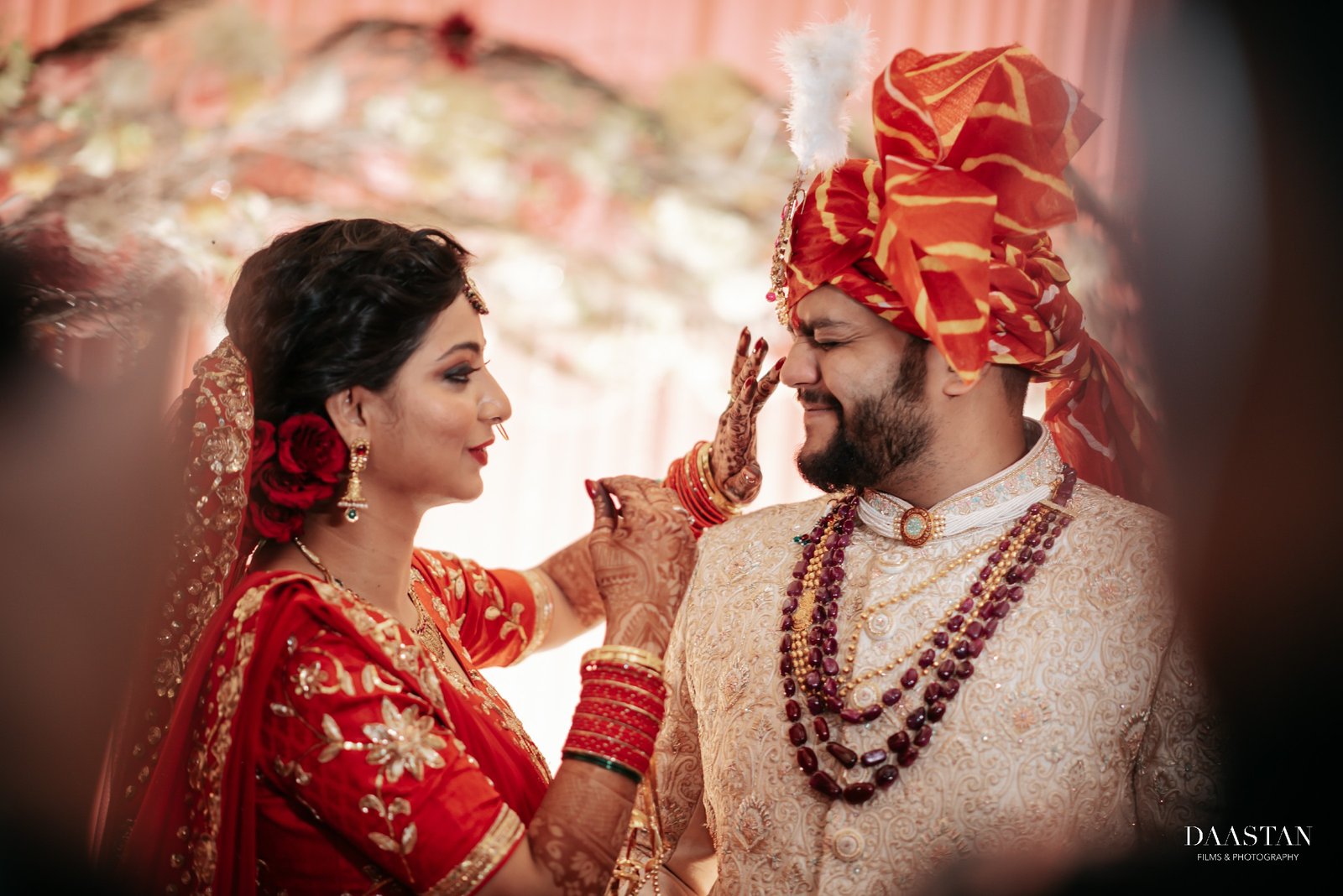 Close portrait of bride and groom with sehra at Indian wedding, cinematic wedding photography