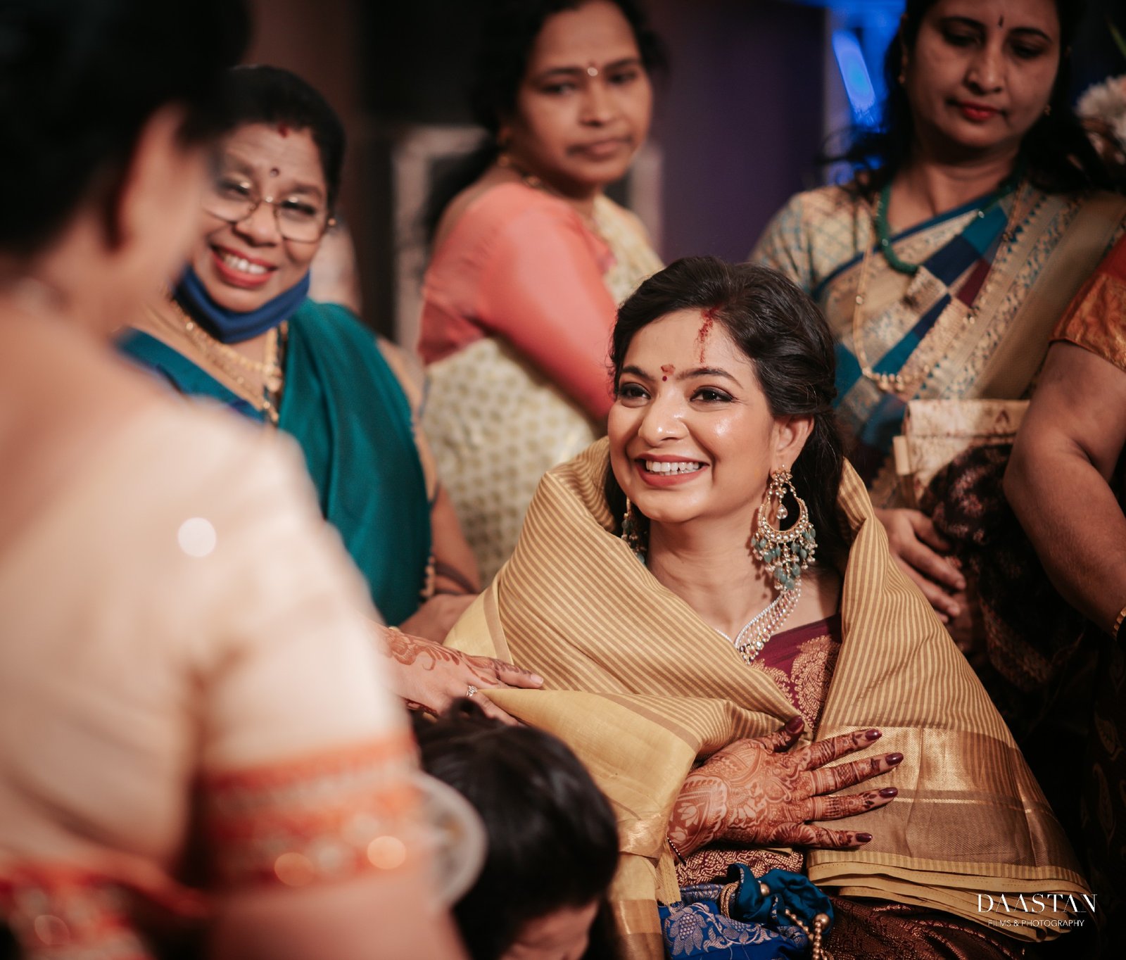 Warm family blessing moment at Indian wedding captured by candid wedding photographers
