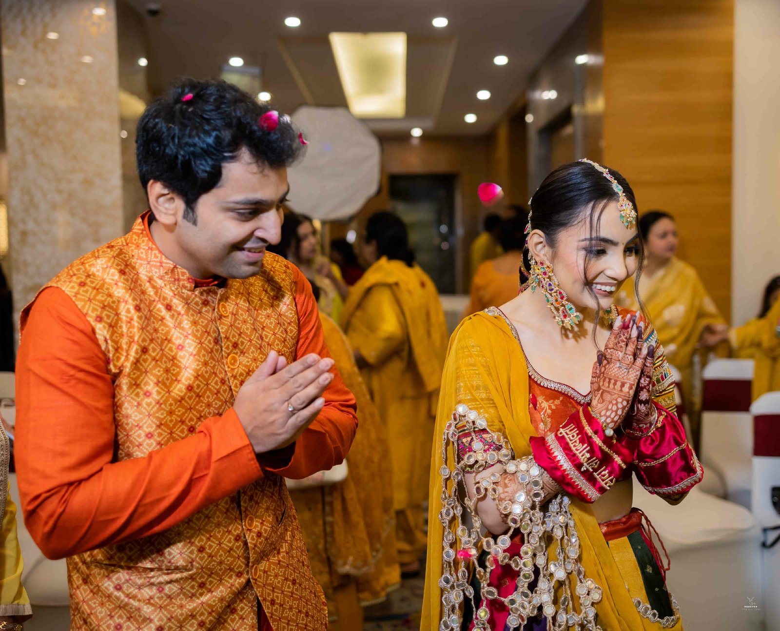 Groom during haldi ritual surrounded by family, professional Indian wedding ceremony photography