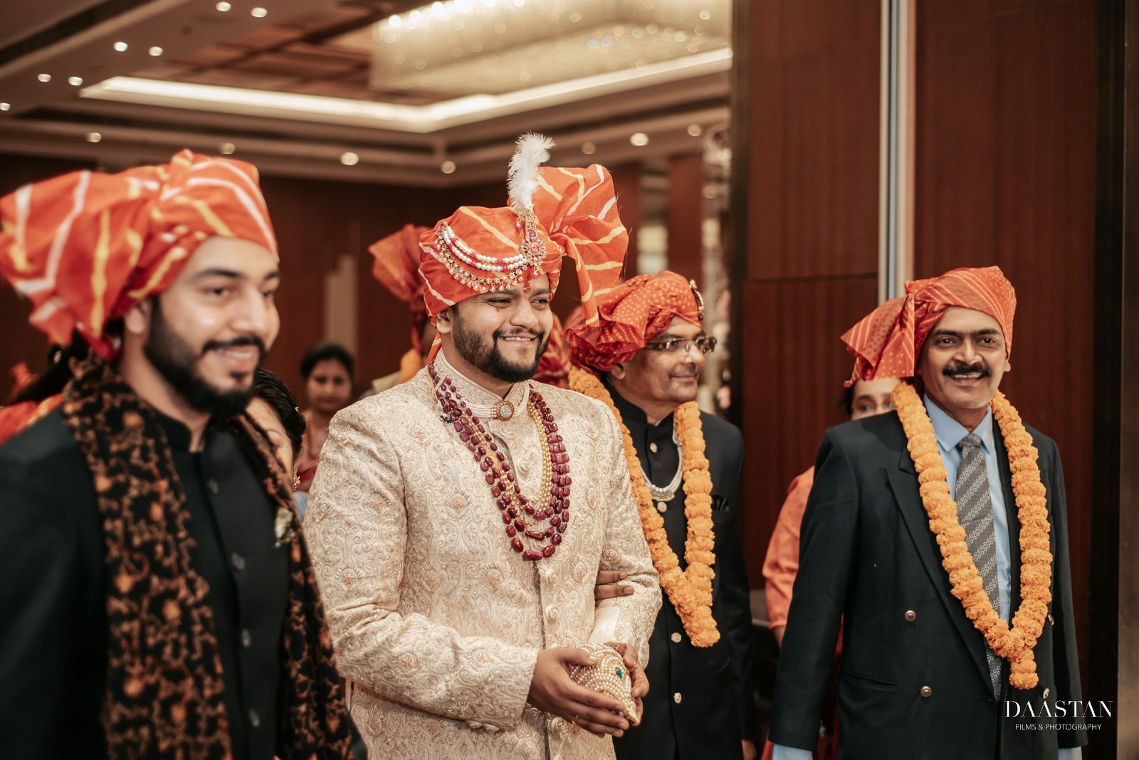 Groom receiving family blessing during sehra ceremony, candid Indian wedding photography