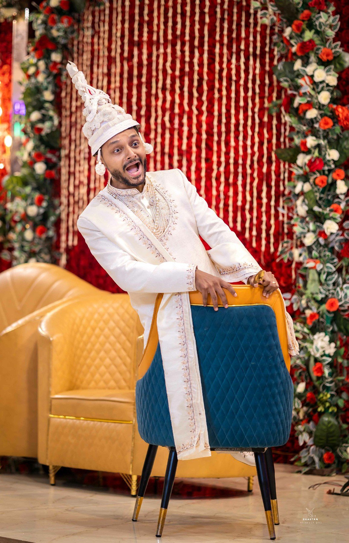Groom in sehra with festive Christmas decor wedding backdrop, Indian wedding photography