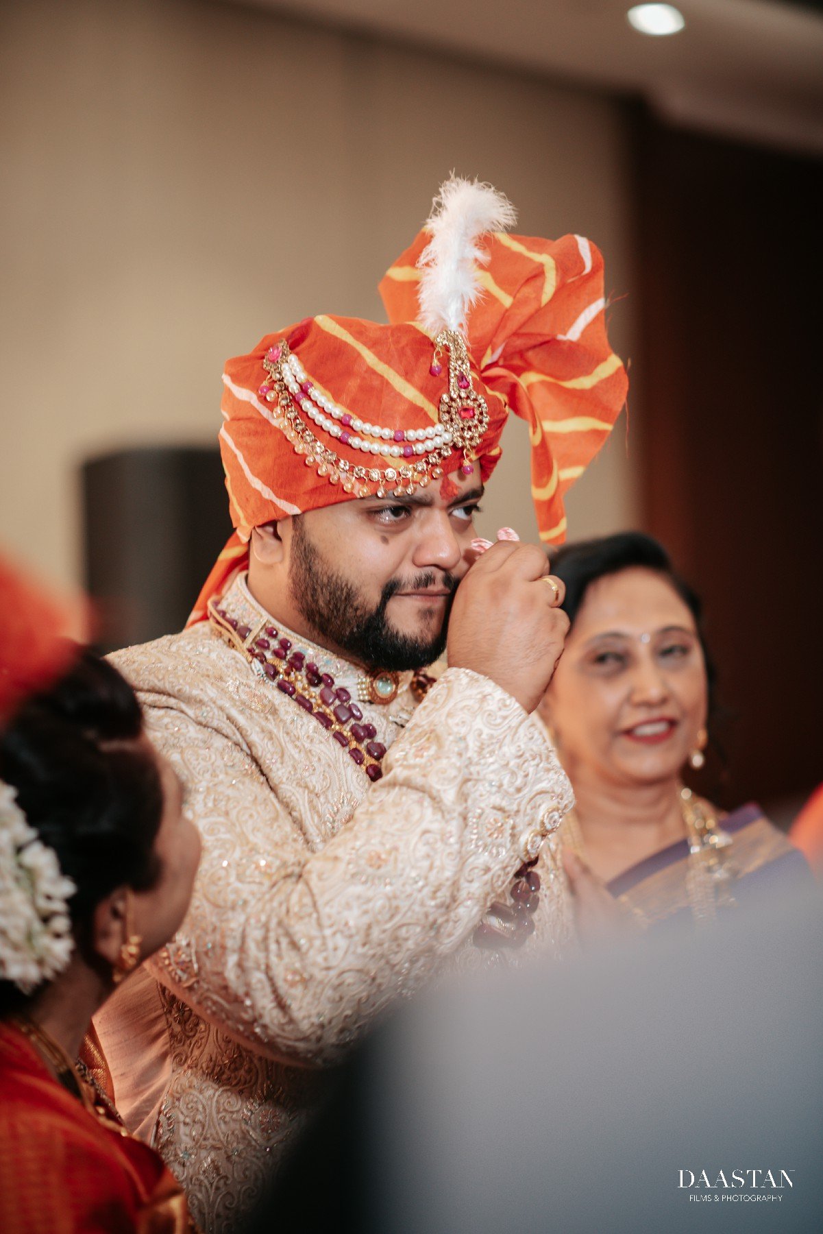 Groom in decorative sehra during jaimala pheras ceremony at Indian wedding