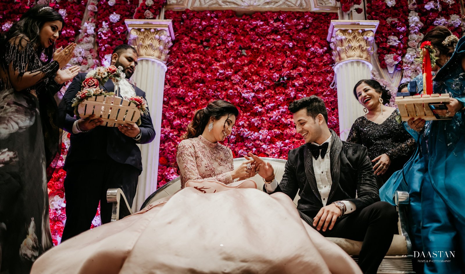 Couple participating in traditional Indian wedding reception rituals, candid photography